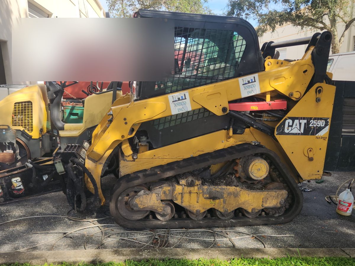 CAT 259D compact track loader parked on a job site after a fuel pump replacement